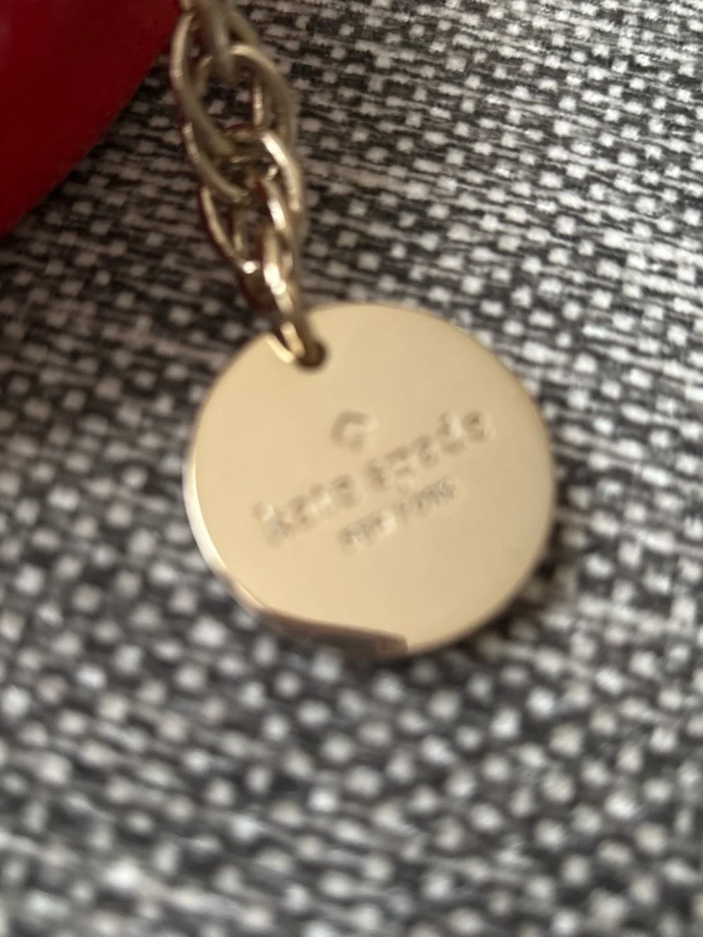 kate spade red round mini crossbody with gold chain
